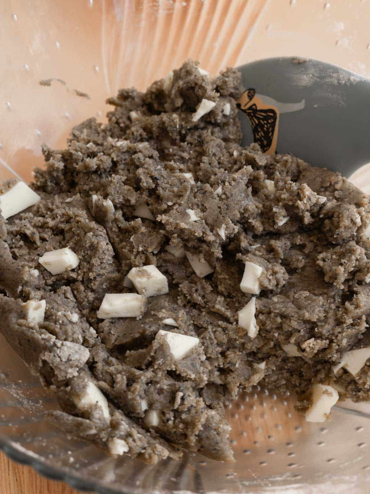 Black sesame cookie dough in bowl ready for scooping.