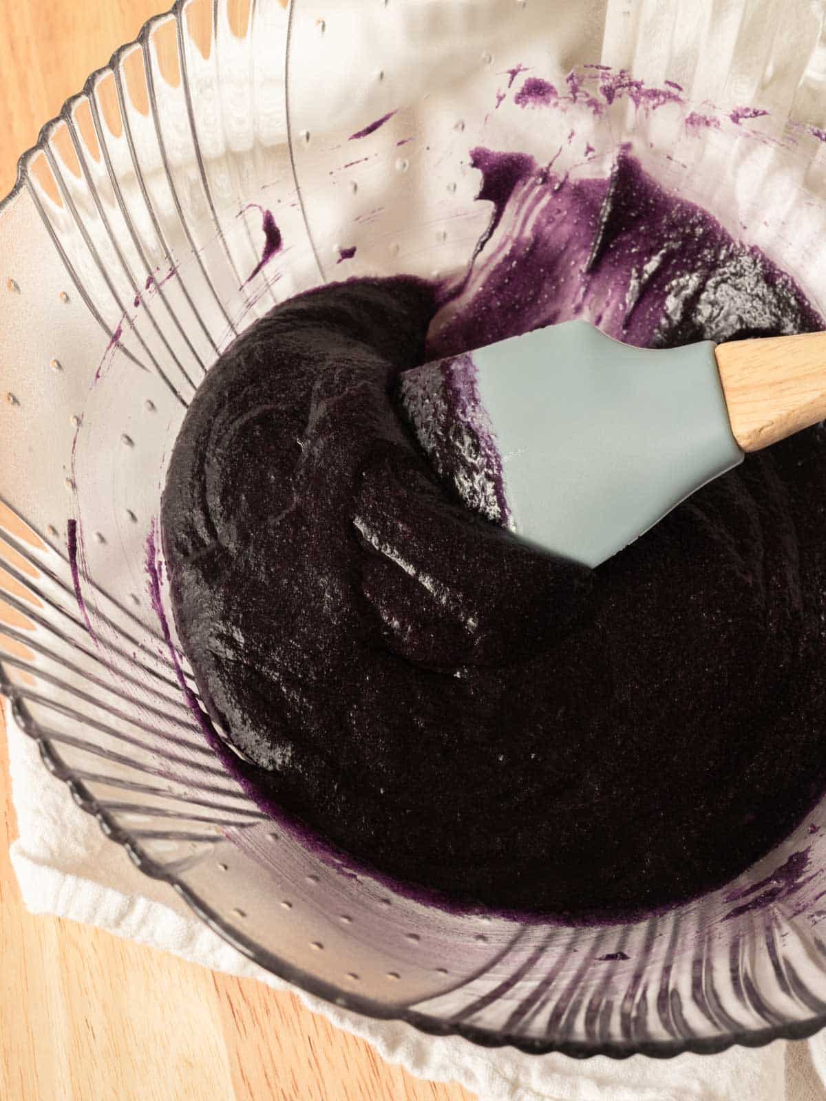 Glass bowl with purple batter.