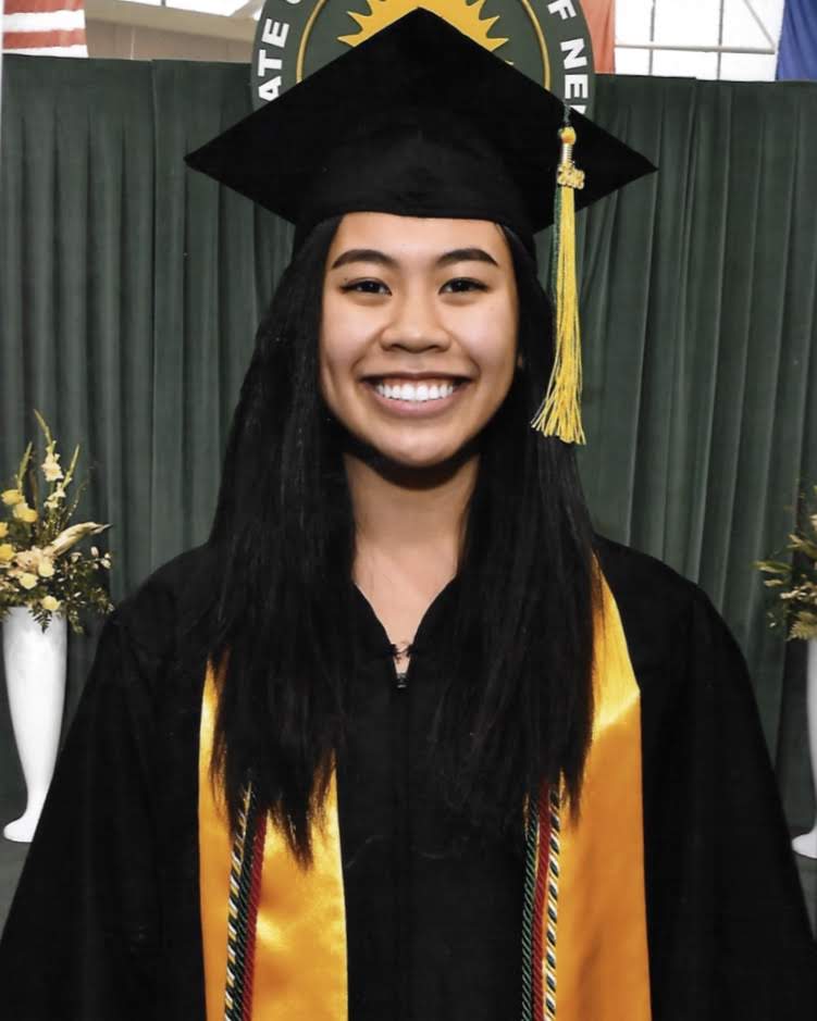 Photo of Bianca in a graduation uniform.