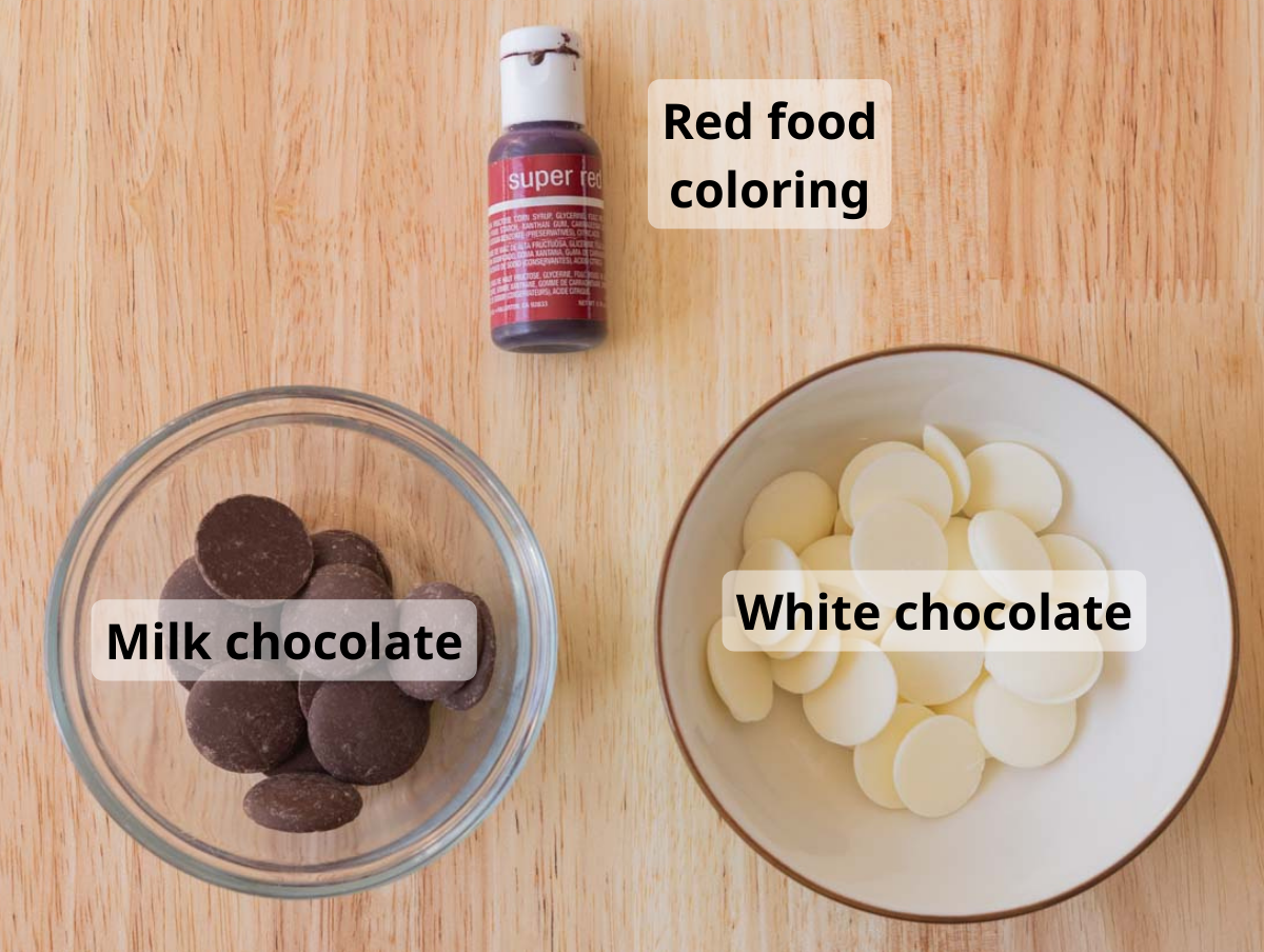 Strawberry cookie decoration labeled ingredients on wooden backdrop.