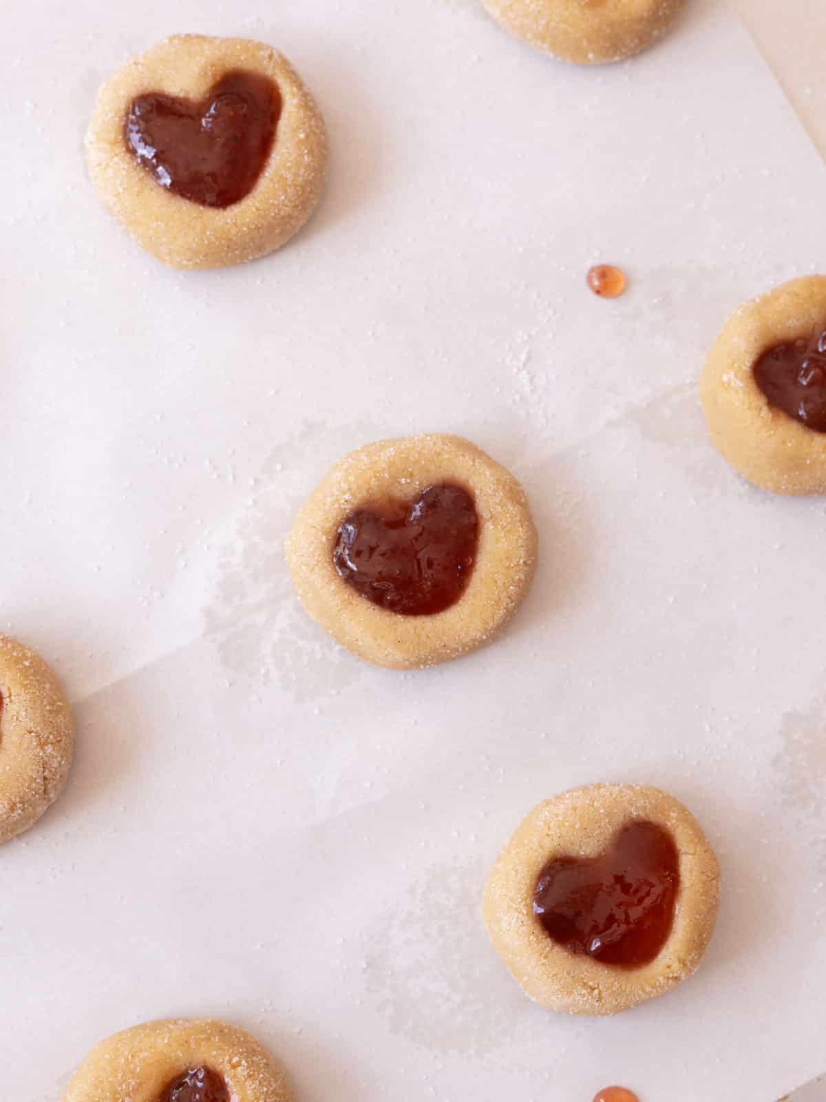 Filled strawberry thumbprint cookies ready to be baked.