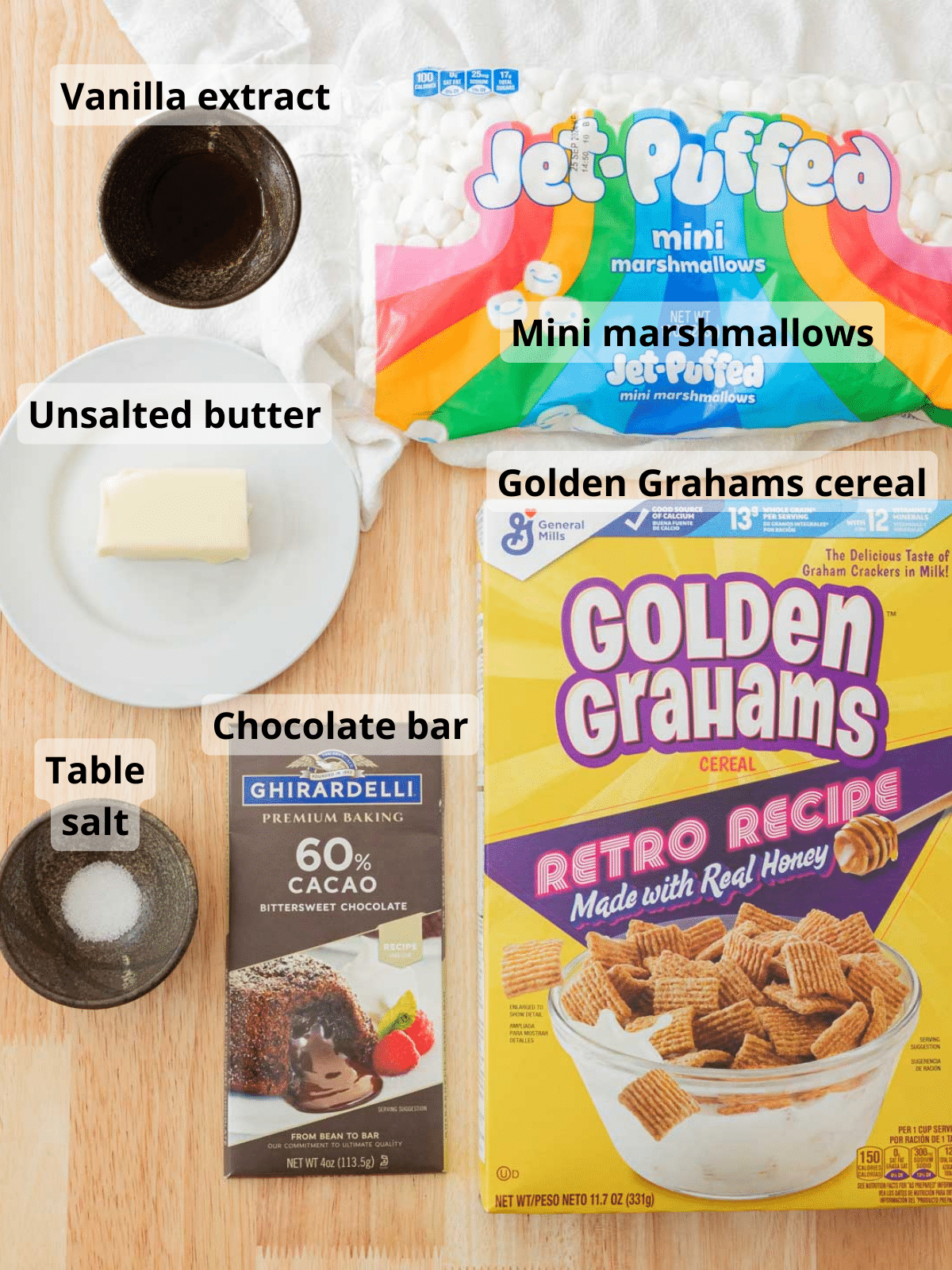 Golden graham bar labeled ingredients laid out on a wooden table.