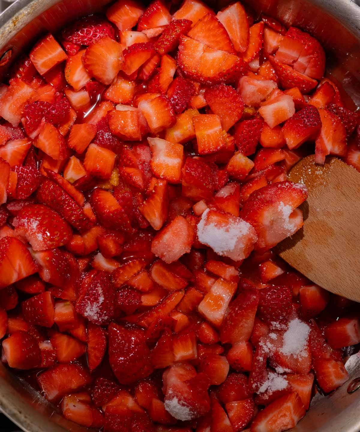 Strawberry jam ingredients in a large saucepan.