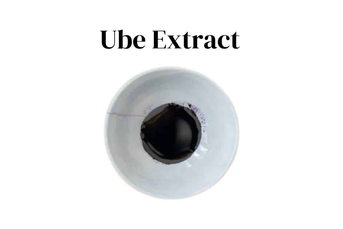 Purple ube extract in a white pinch bowl with a white background.