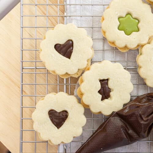 Linzer cookies filled with chocolate ganache and matcha ganache.