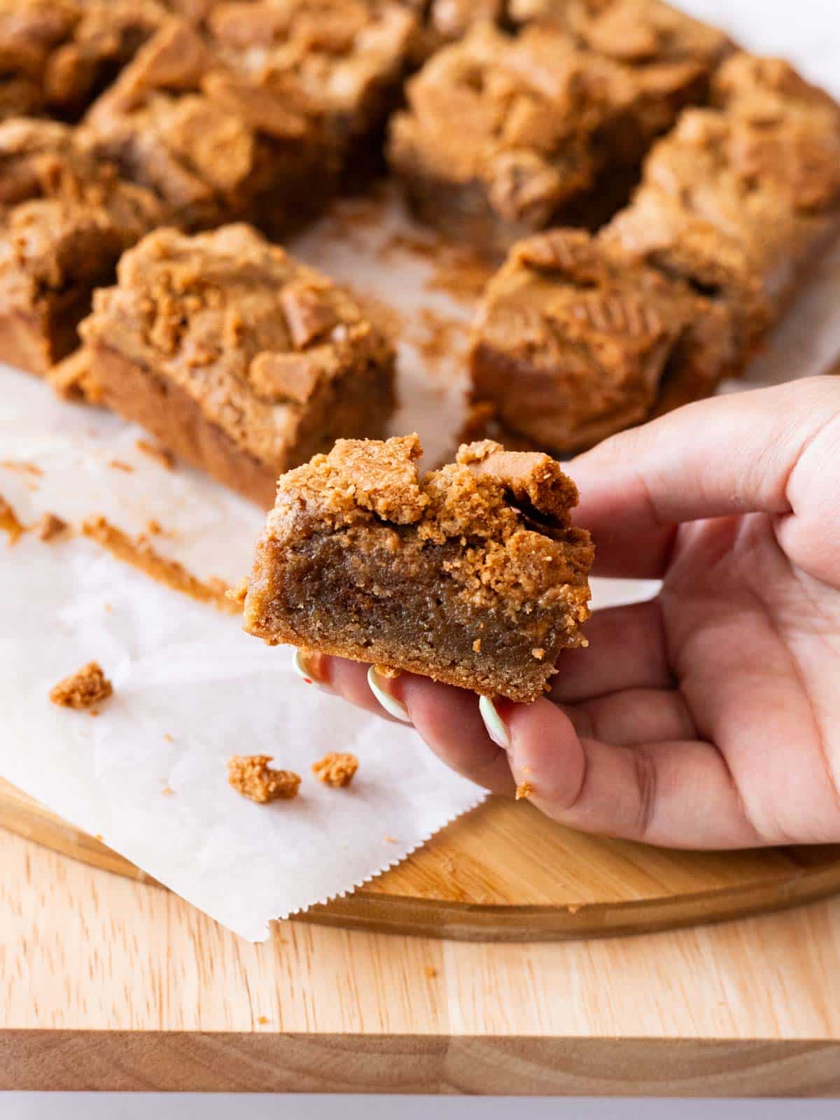 Holding a speculoos blondie bar in hand to show cross section.