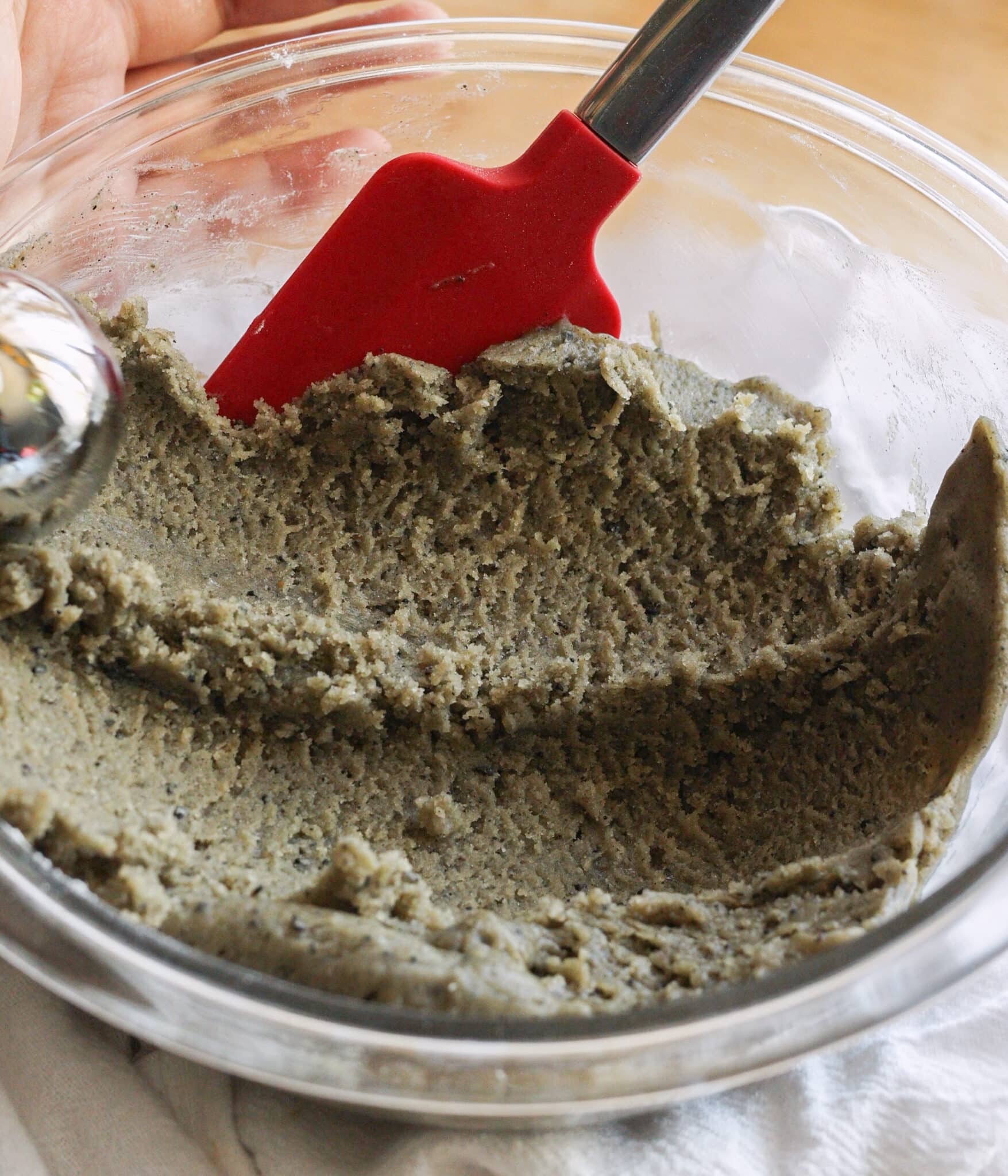 Black sesame sugar cookie dough ready to be scooped.