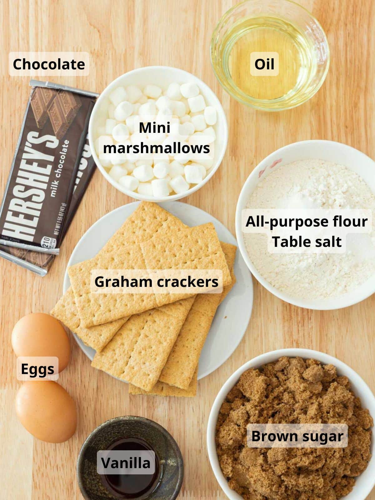 Labeled s'mores blondie bars ingredients laid out on a table.