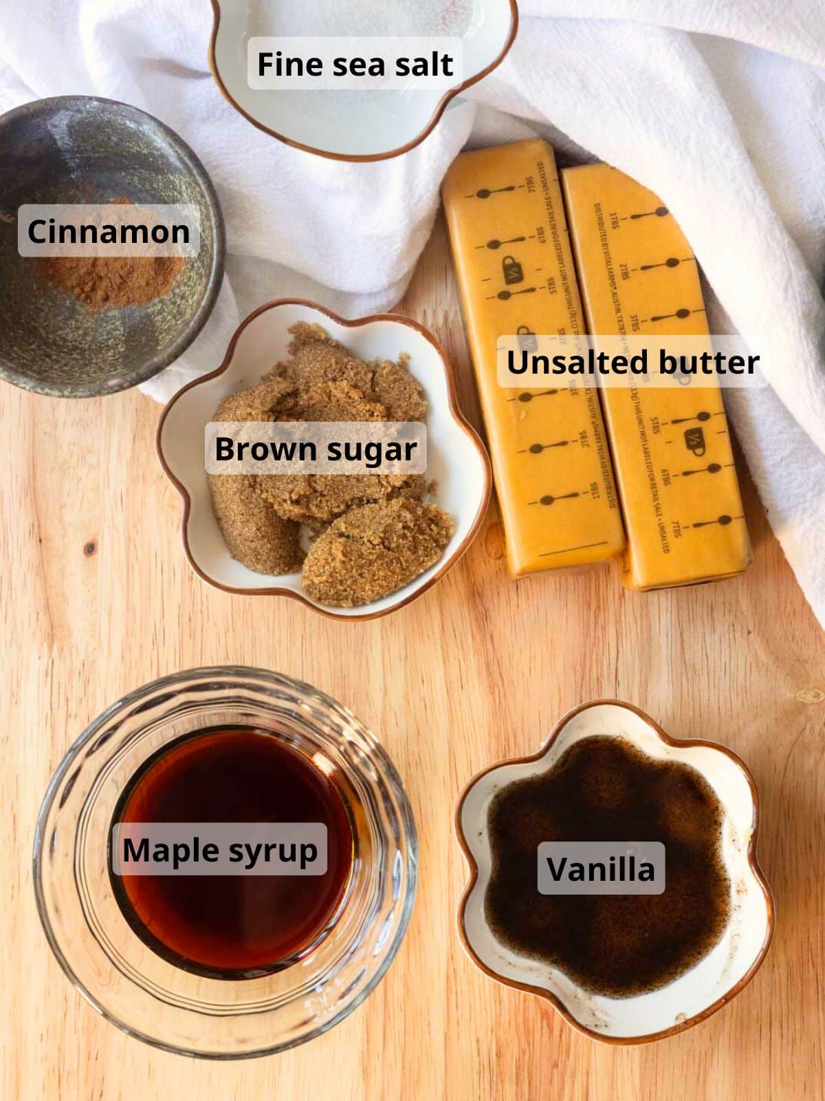 Labeled brown sugar maple syrup butter ingredients on a wooden table.