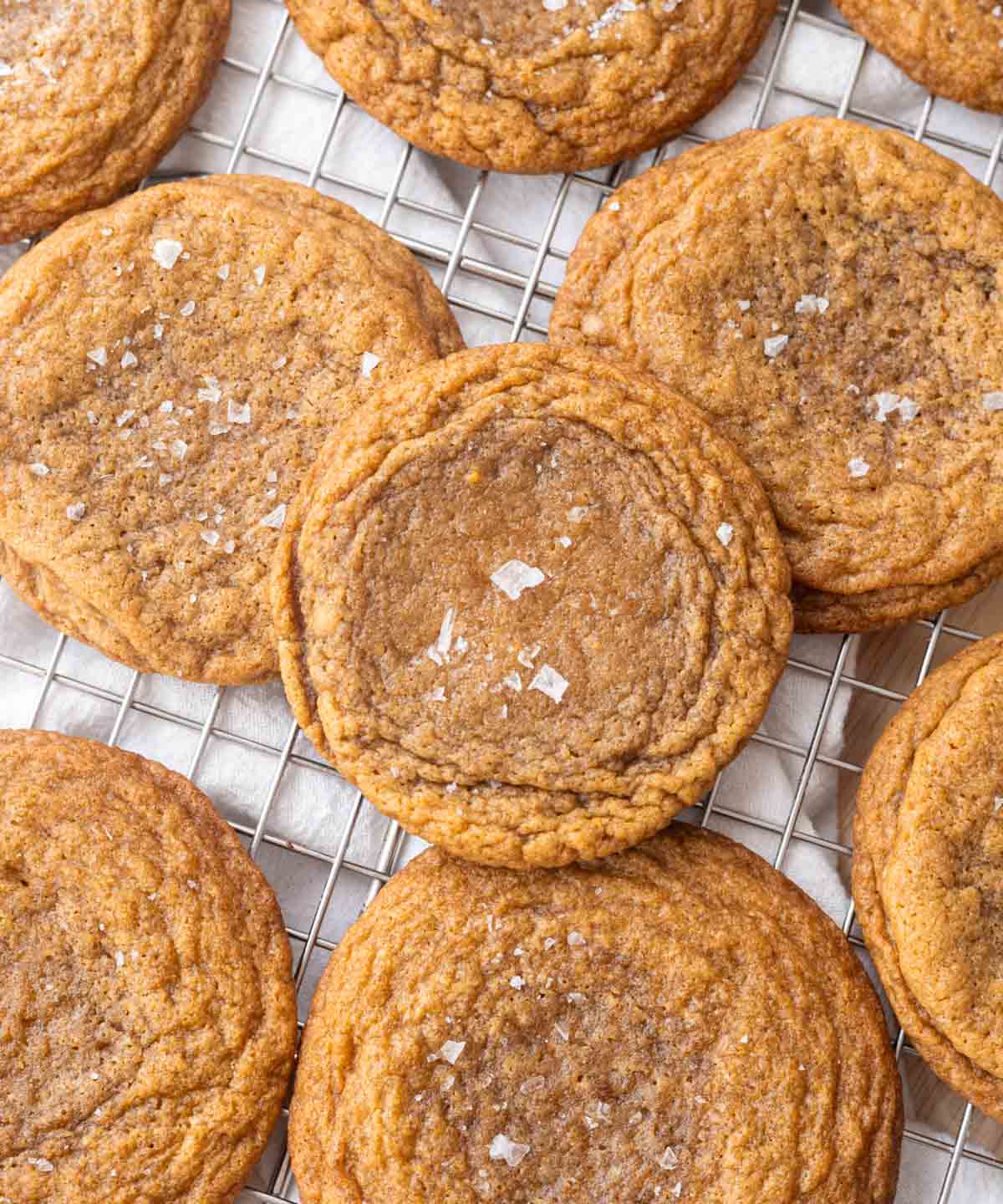 Chocolate chipless cookies on a wire rack.