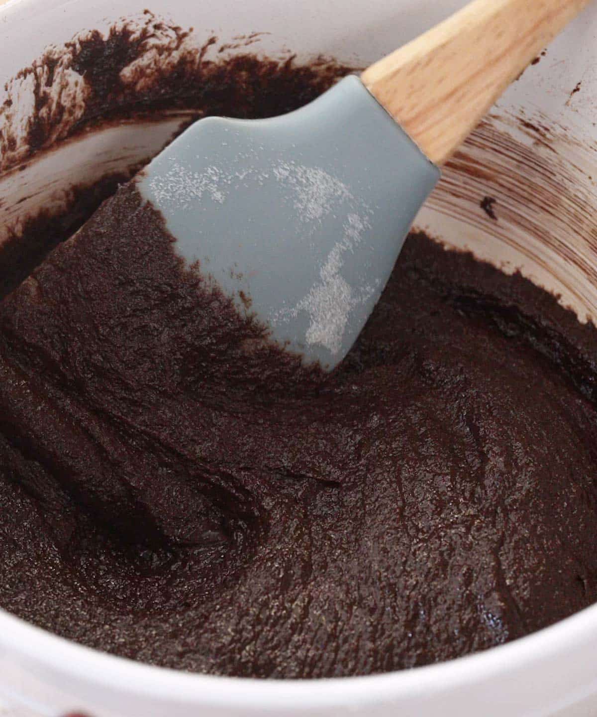 Chocolate cookie wet ingredients mixed in bowl.