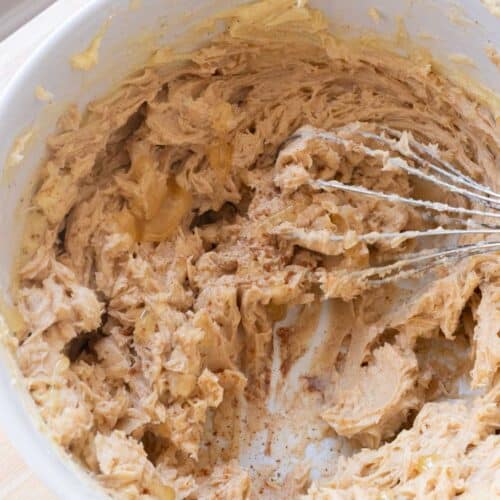 Homemade cinnamon honey butter in a white mixing bowl.