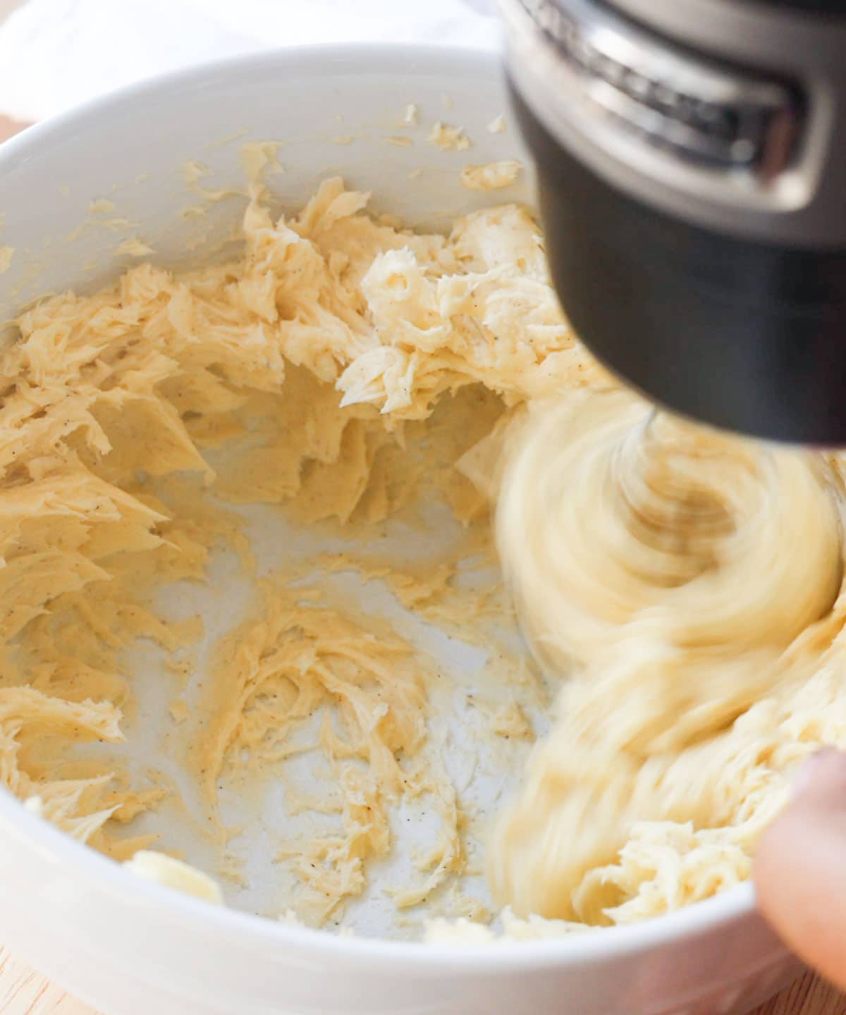 Mixing in honey, vanilla, and salt into butter.