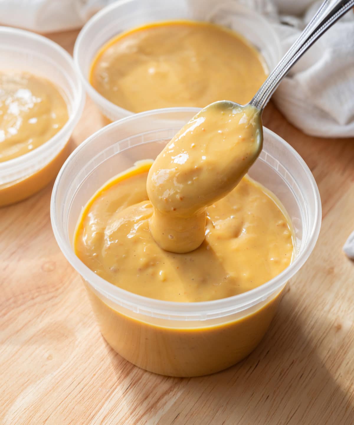 Leche flan pudding in a container.