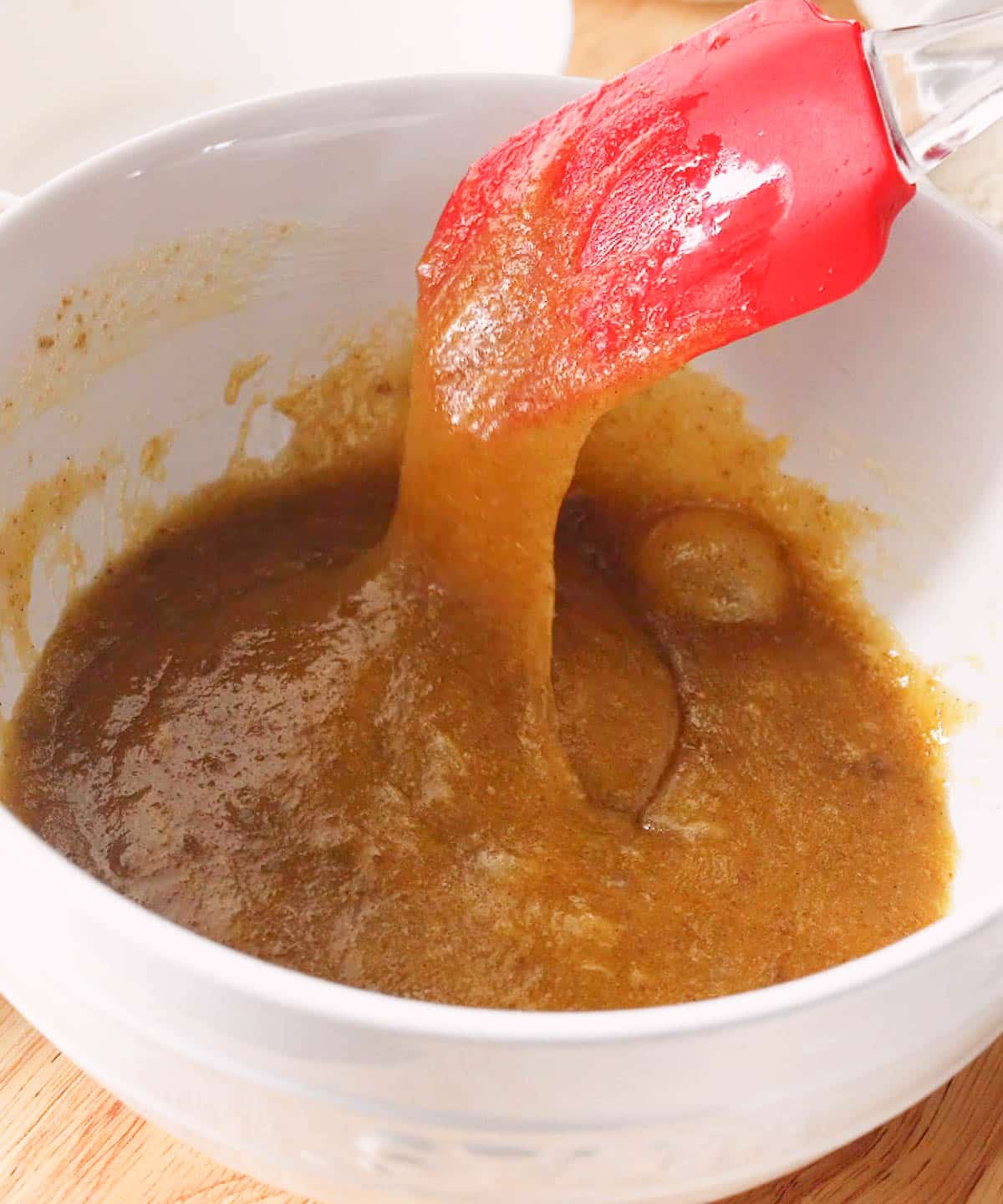 Wet ingredients mixed in white mixing bowl.