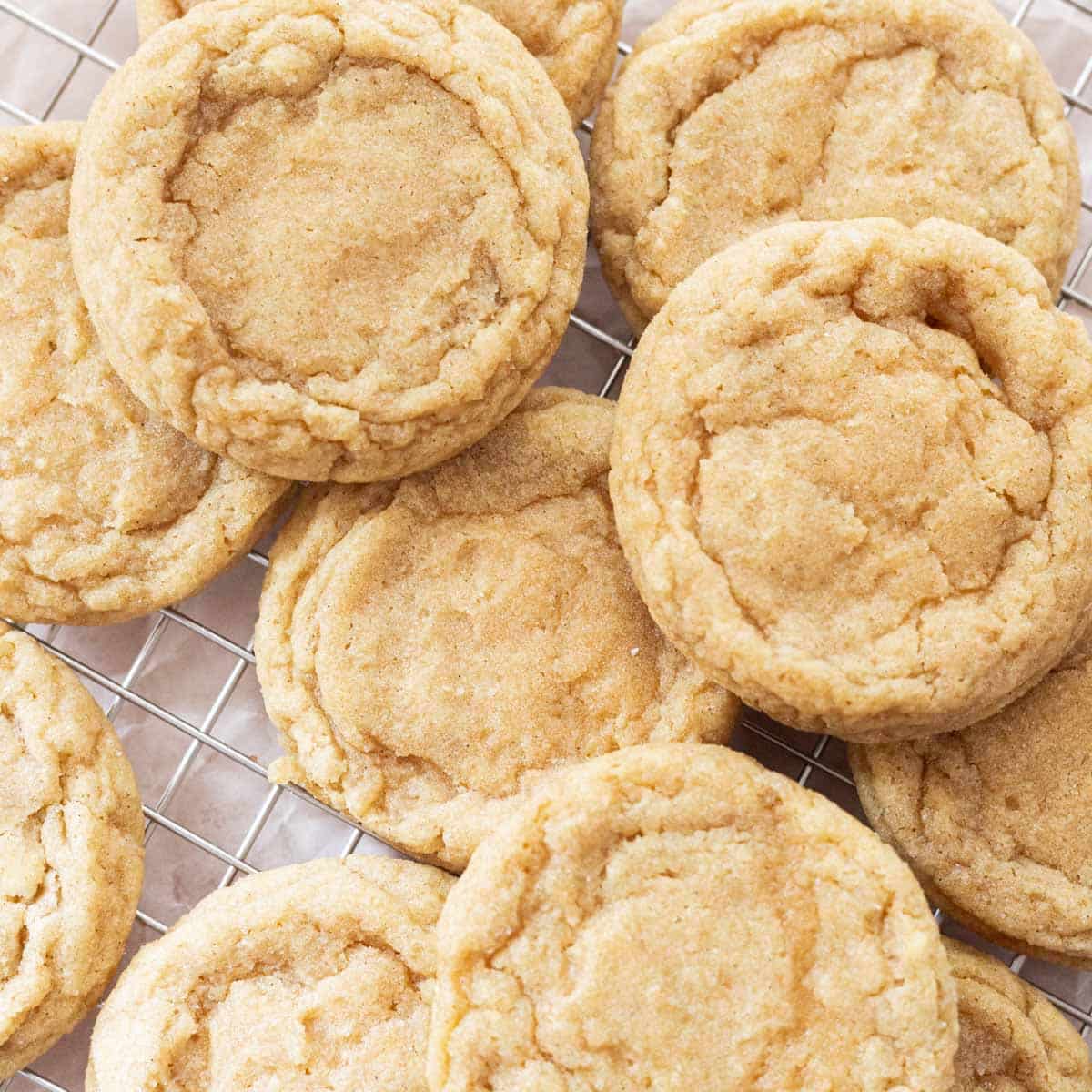 Chewy sugar cookies laid out on a wire rack.