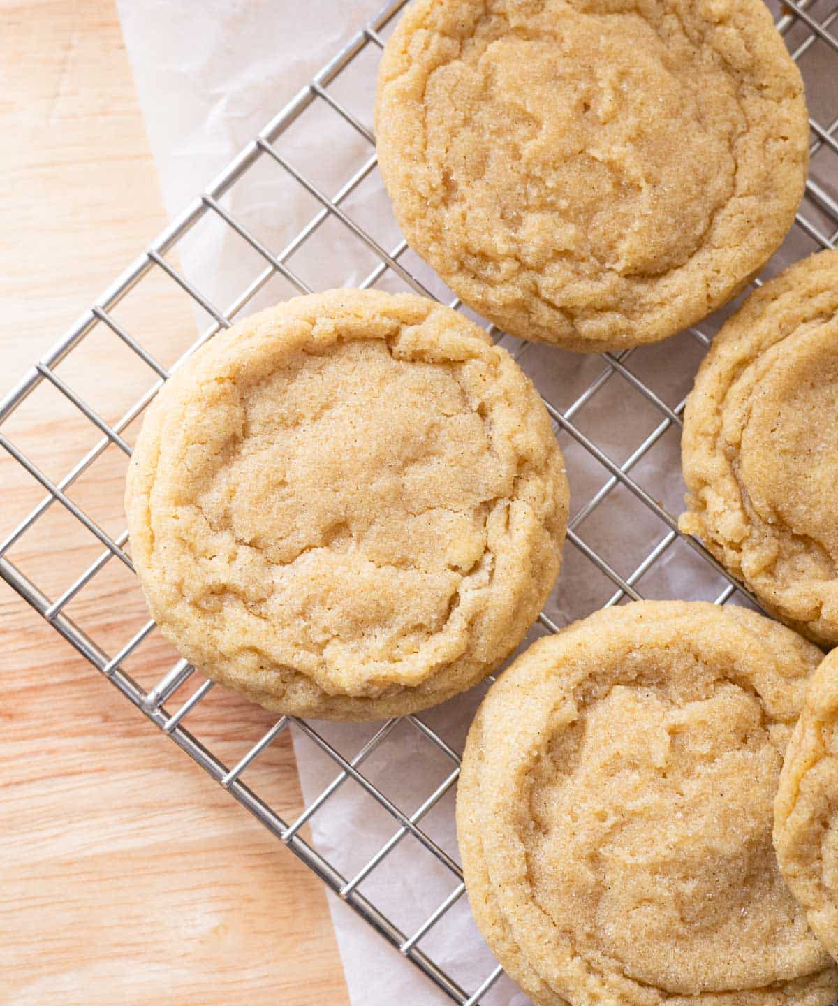 Sugar cookies cooling on a wire rack.