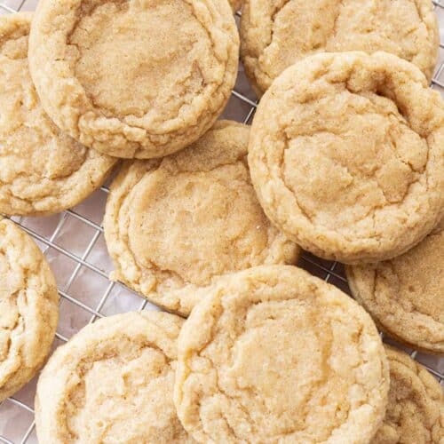 Chewy sugar cookies laid out on a wire rack.