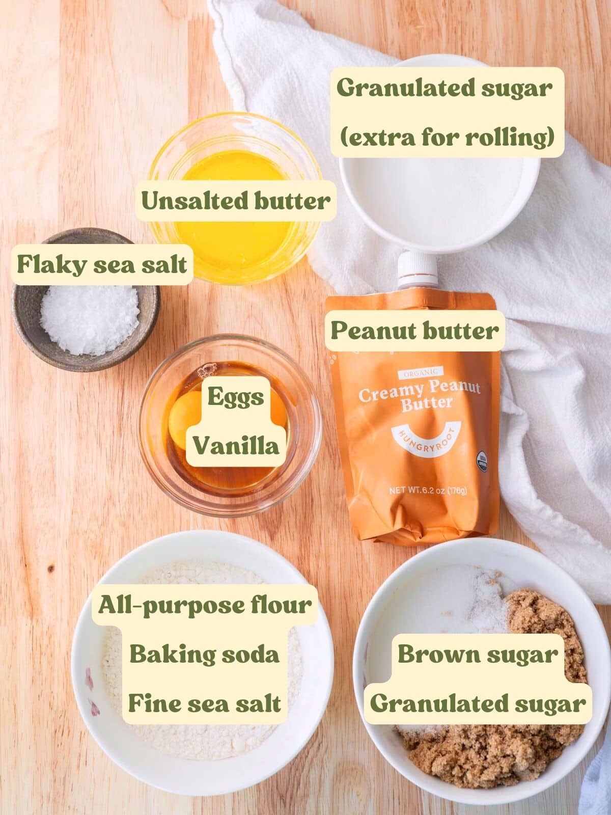 Peanut butter cookie labeled ingredients on a wooden table.