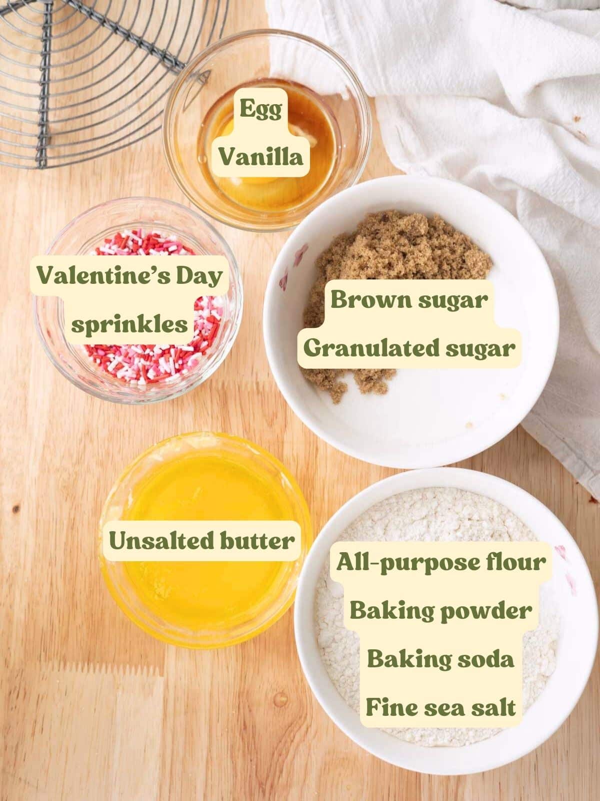 Valentine's sprinkle sugar cookie labeled ingredients on a wooden table.