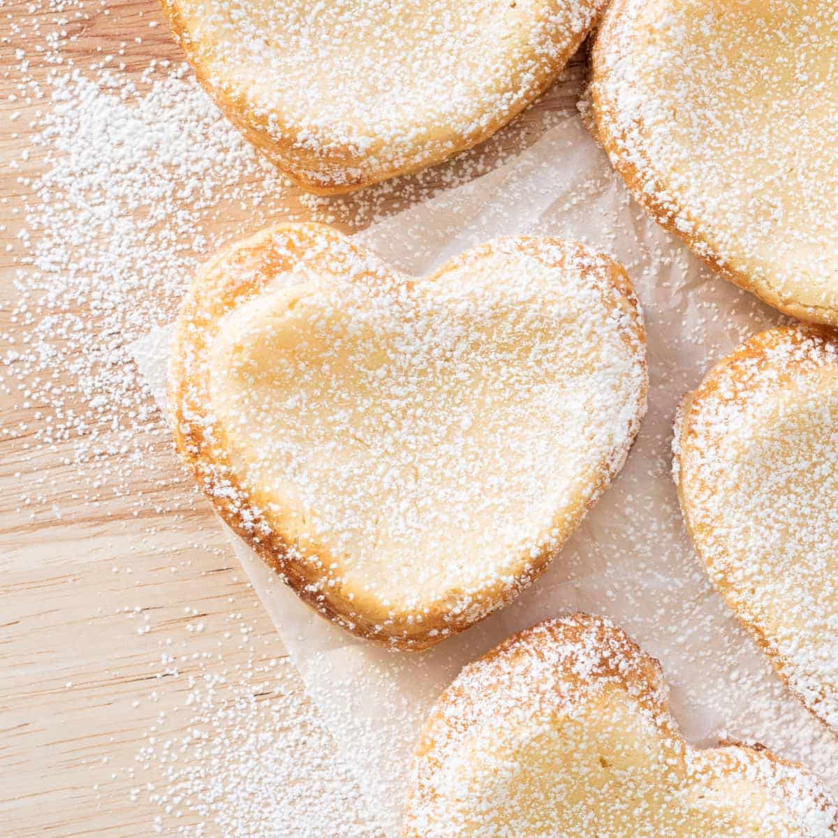 Chai danish hearts covered in powdered sugar.