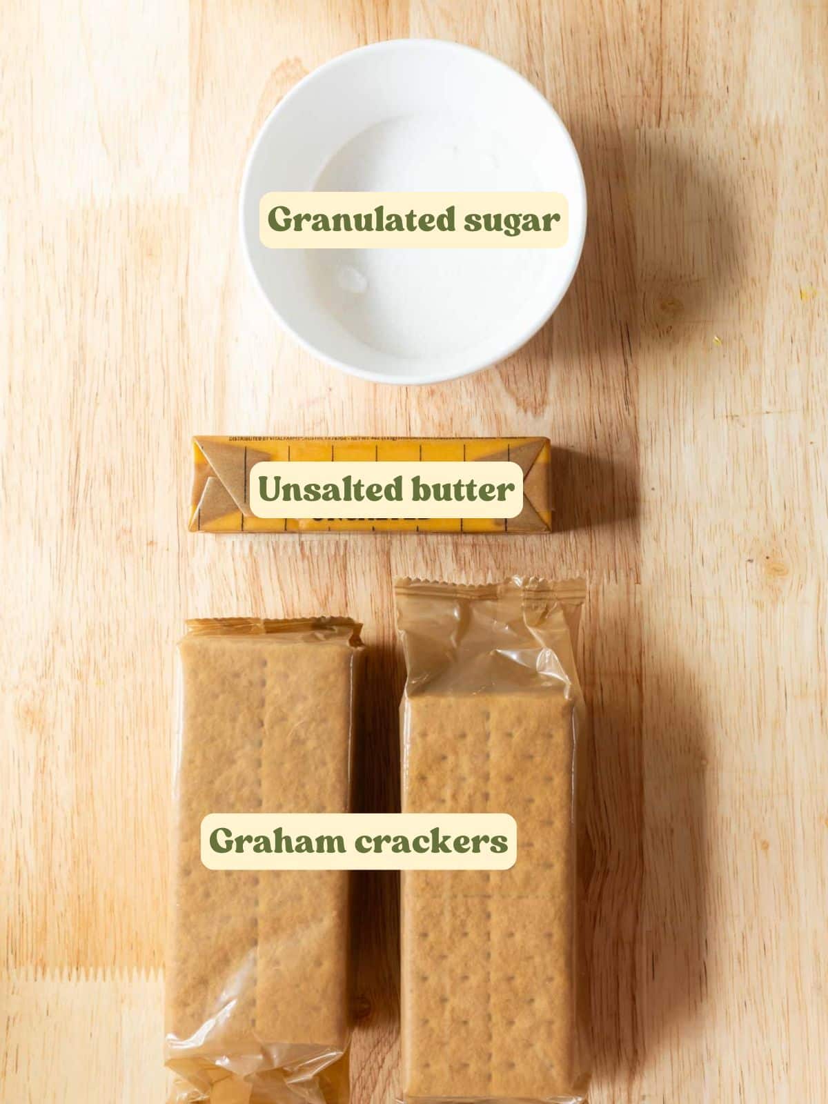 No bake graham cracker crust labeled ingredients on a wooden table.