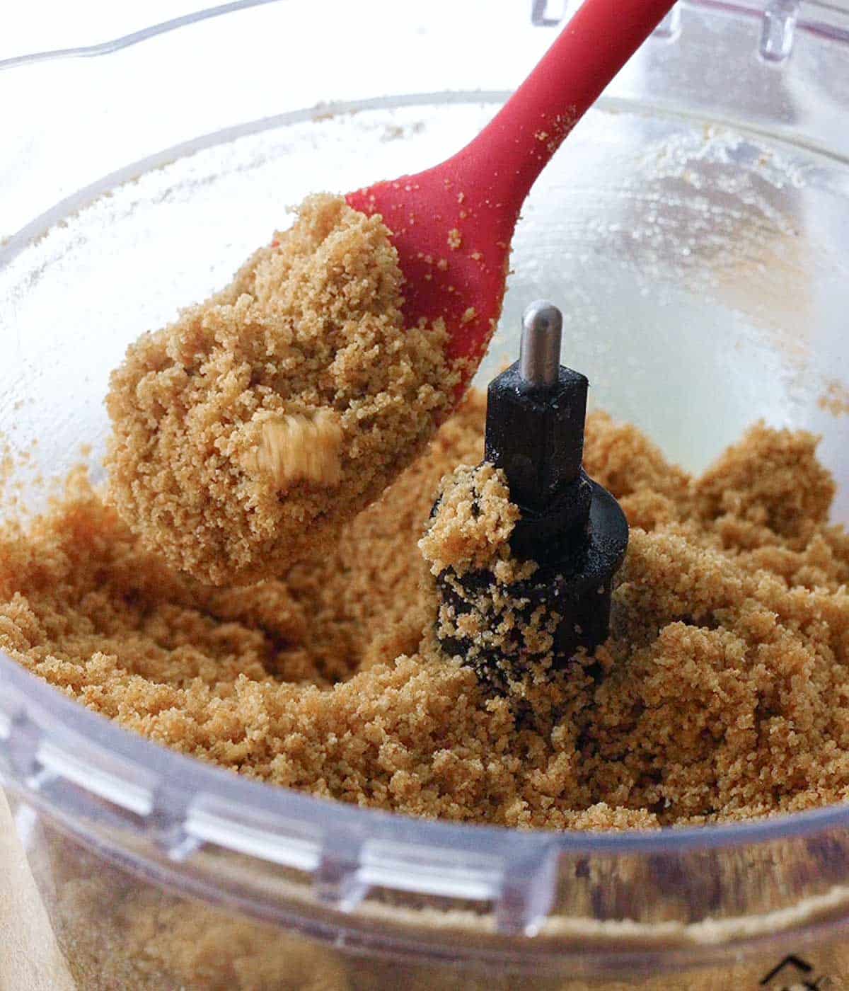 Graham cracker crust ingredients blitzed in a food processor until it reaches the texture of wet sand.