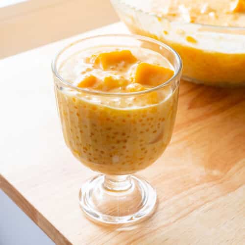 Mango sago in a glass cup.