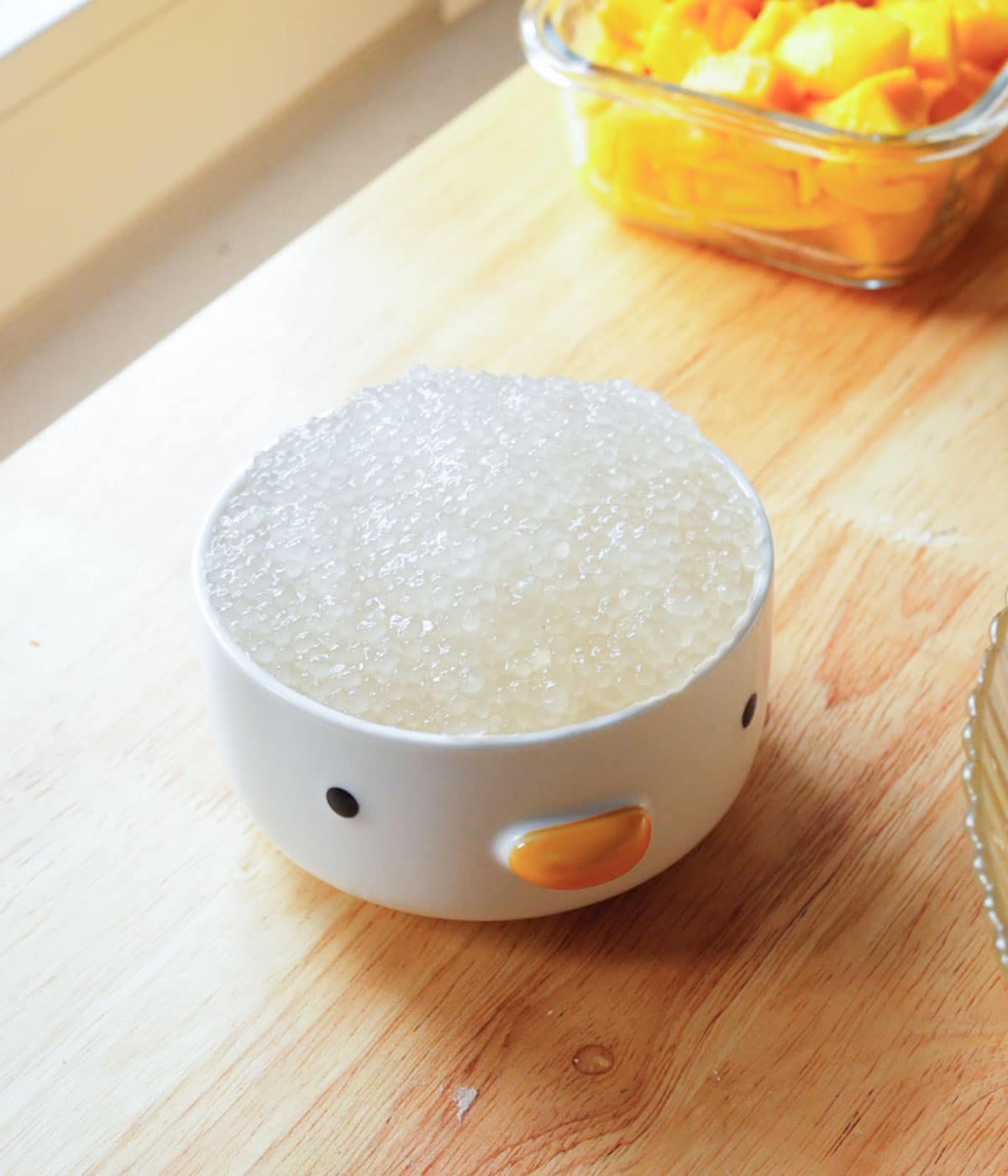 Cooked small tapioca pearls in a white bowl.