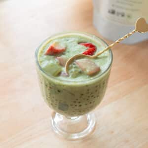 Strawberry matcha latte sago in a glass serving cup.