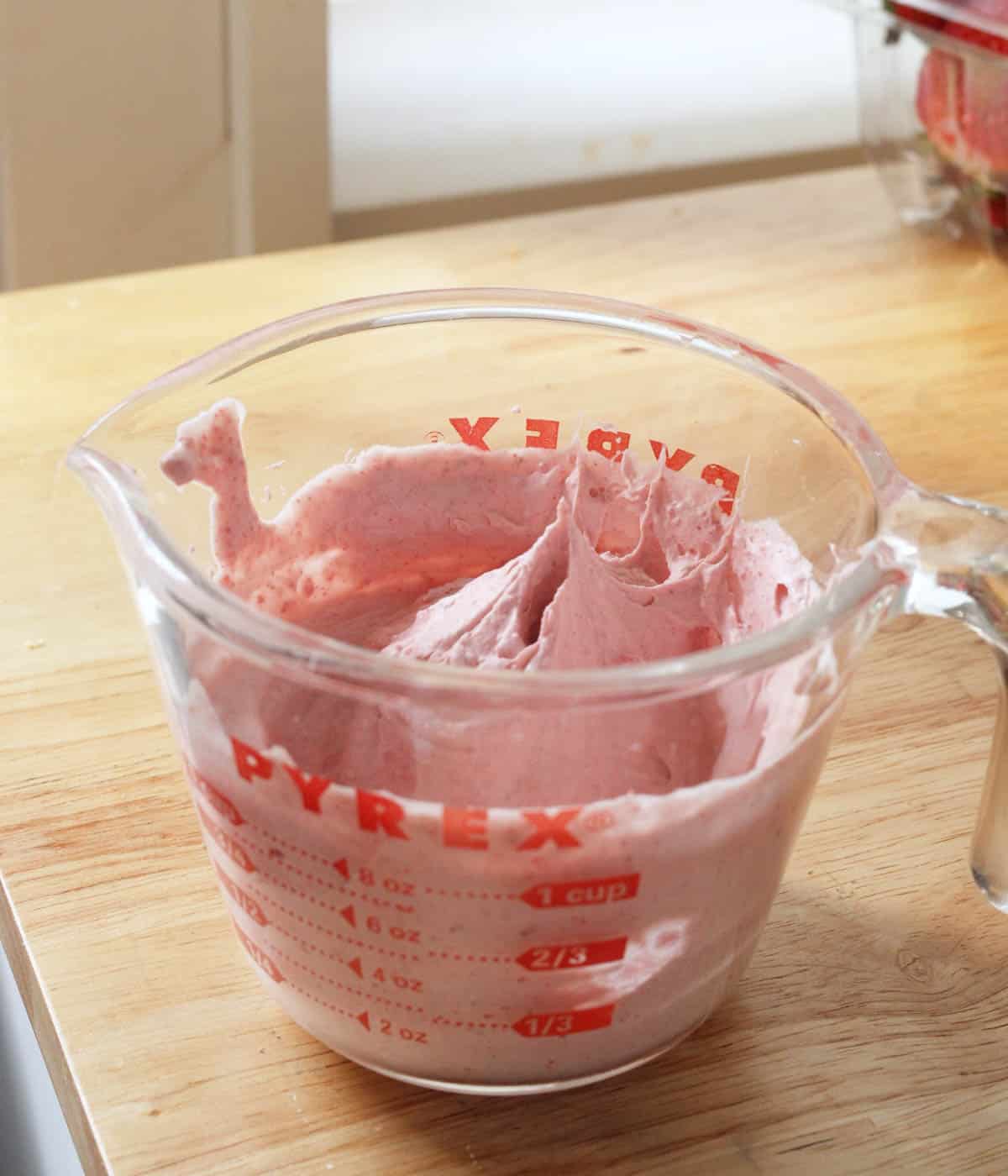Finished strawberry whipped cream in cup.