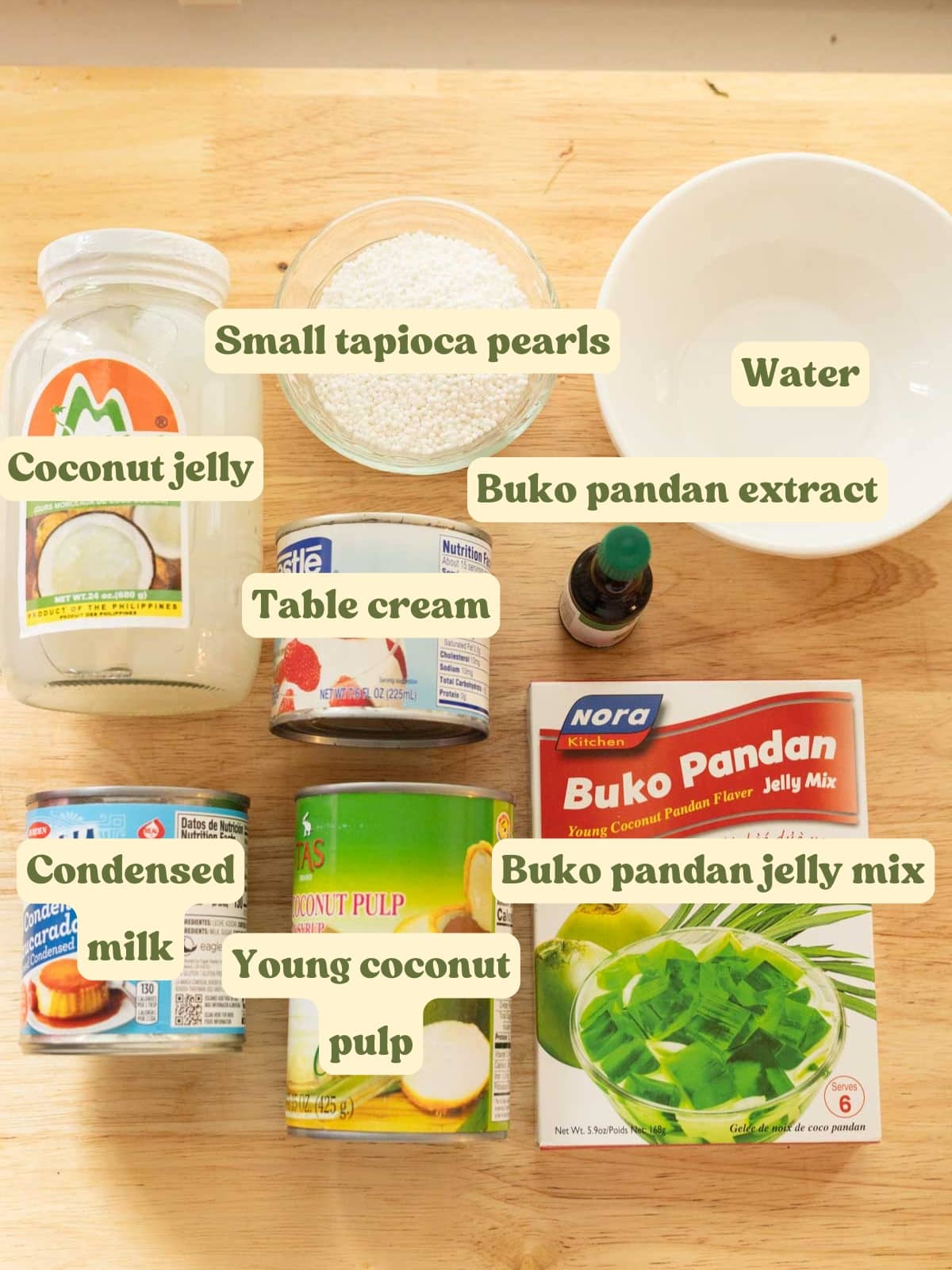 Filipino buko pandan ingredients on a wooden table.
