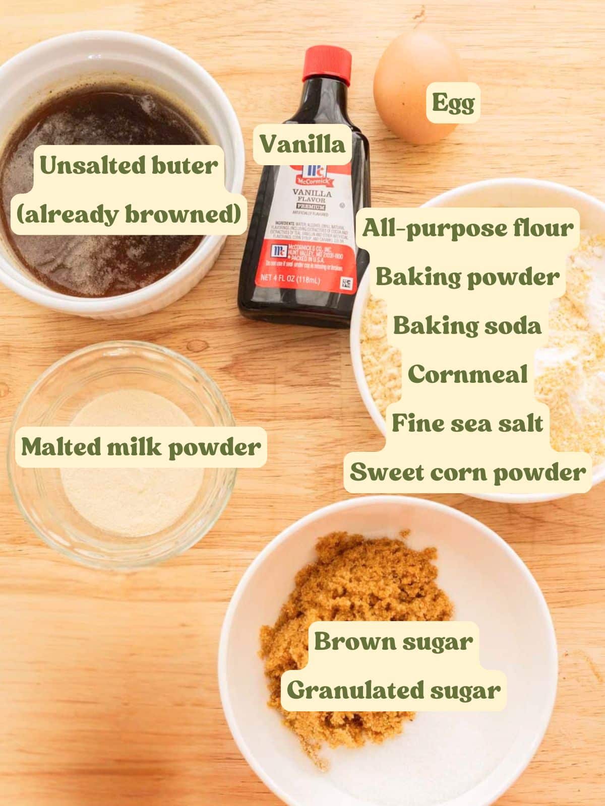 Roll out corn cookie ingredients on a wooden table.