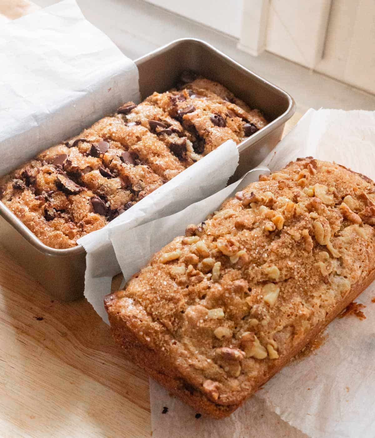 Chocolate chip banana bread and walnut banana bread next to each other.