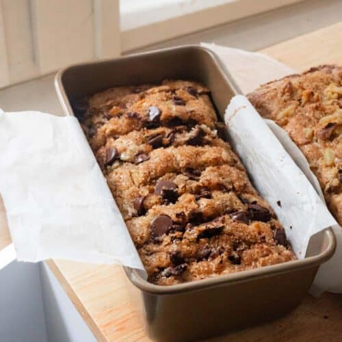 Sliced chocolate chip banana bread in loaf pan.