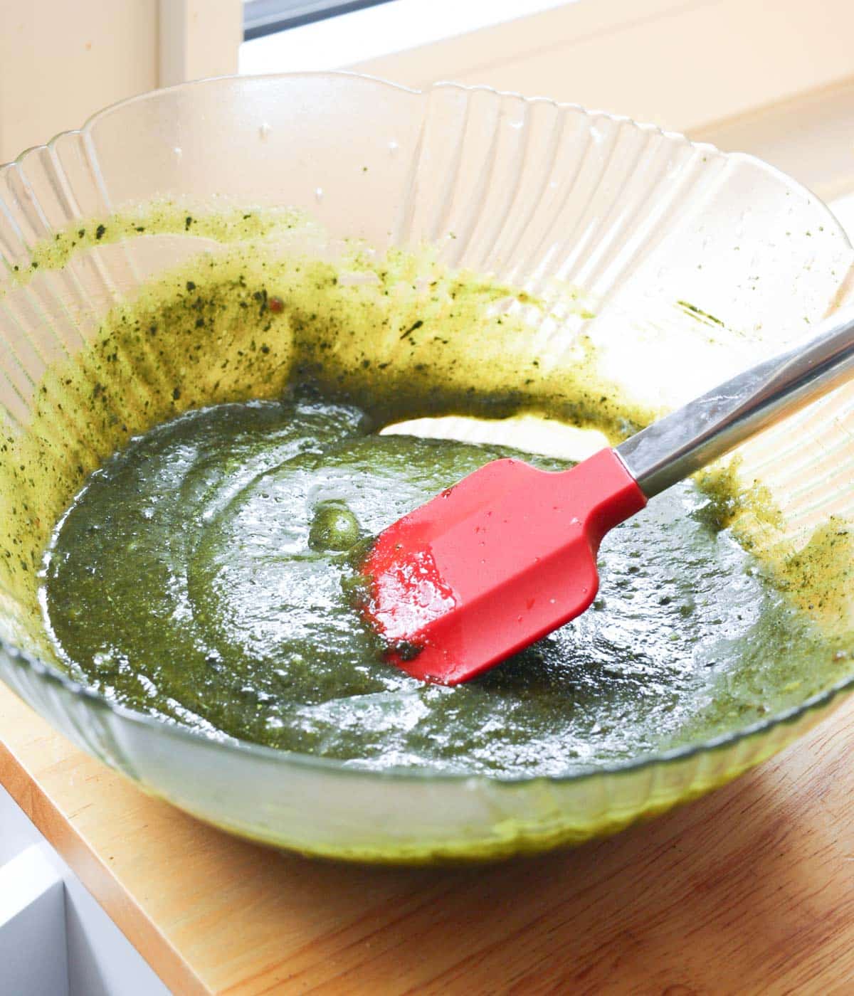 Sugars, butter, eggs, vanilla, and matcha powder mixed in a bowl.