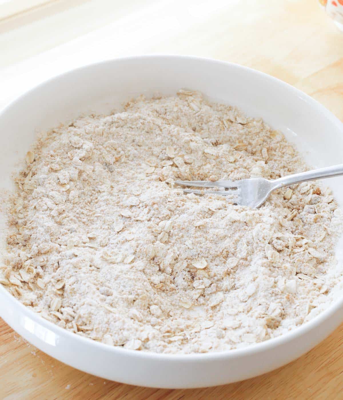 Homemade crumble dry ingredients mixed in a bowl.