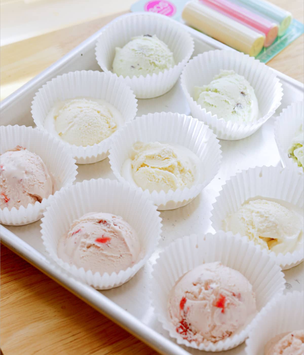 Scooped ice cream in cupcake liners.