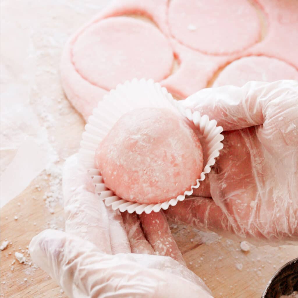 Strawberry mochi ice cream in cupcake liner.