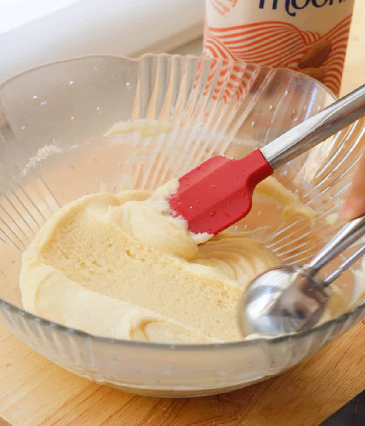Almond mochi donut batter being scooped.