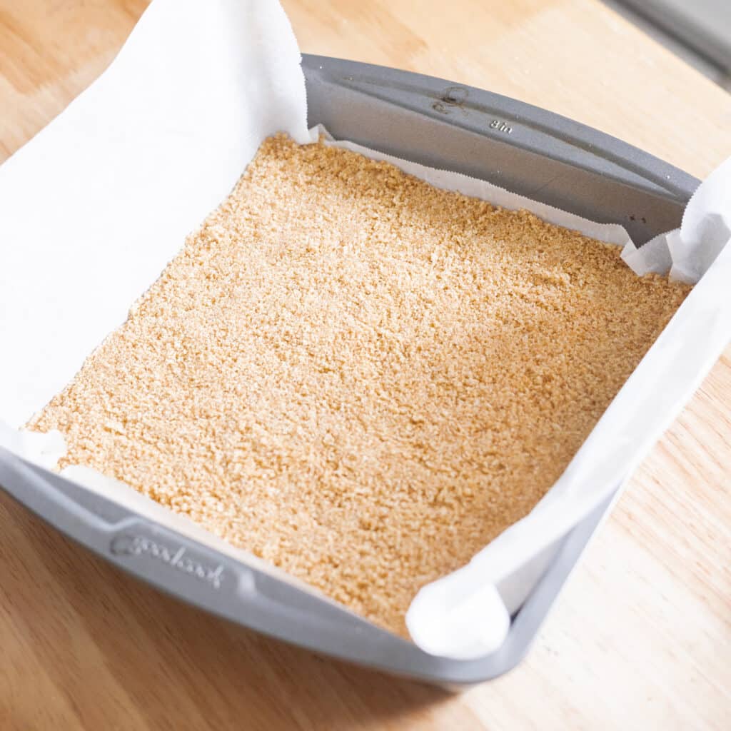 Graham cracker crust in 8x8 baking pan.