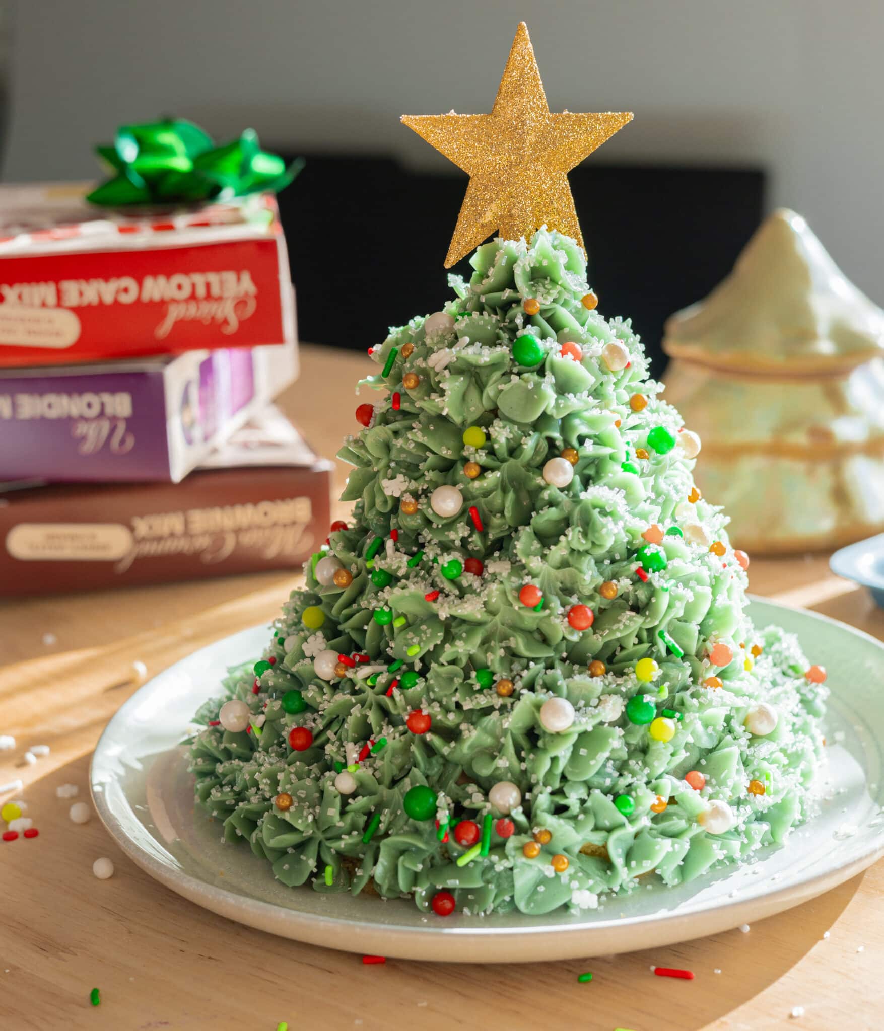 Christmas tree cake decorated with sprinkles.