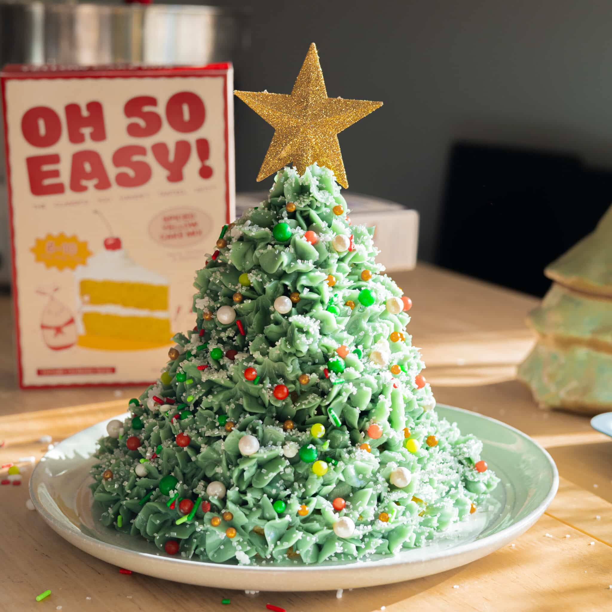 Christmas tree cake decorated with sprinkles.