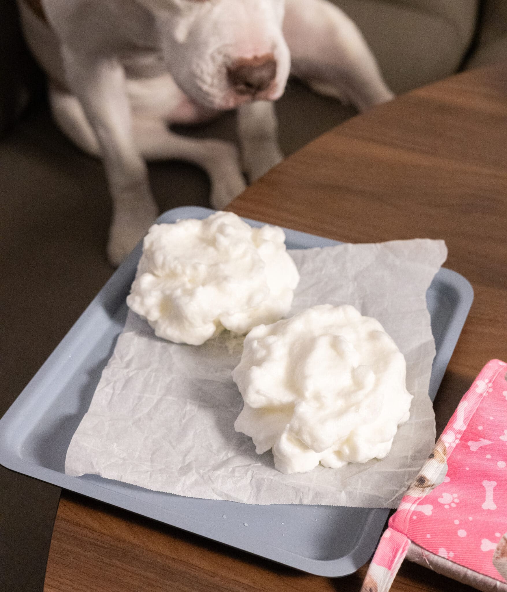 Egg white cake layers on lined baking sheet.