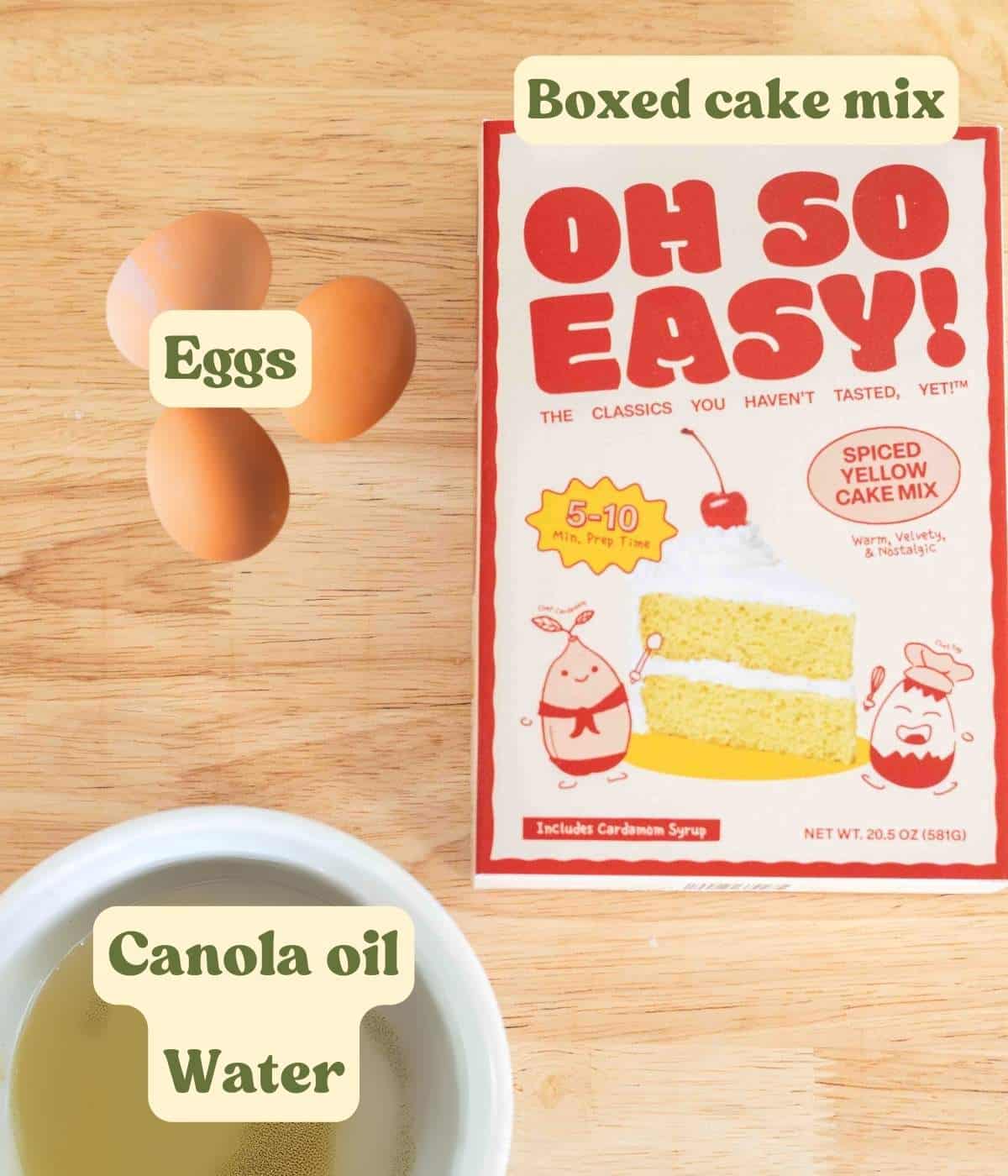 Spiced yellow cake mix labeled ingredients laid out on a wooden table.