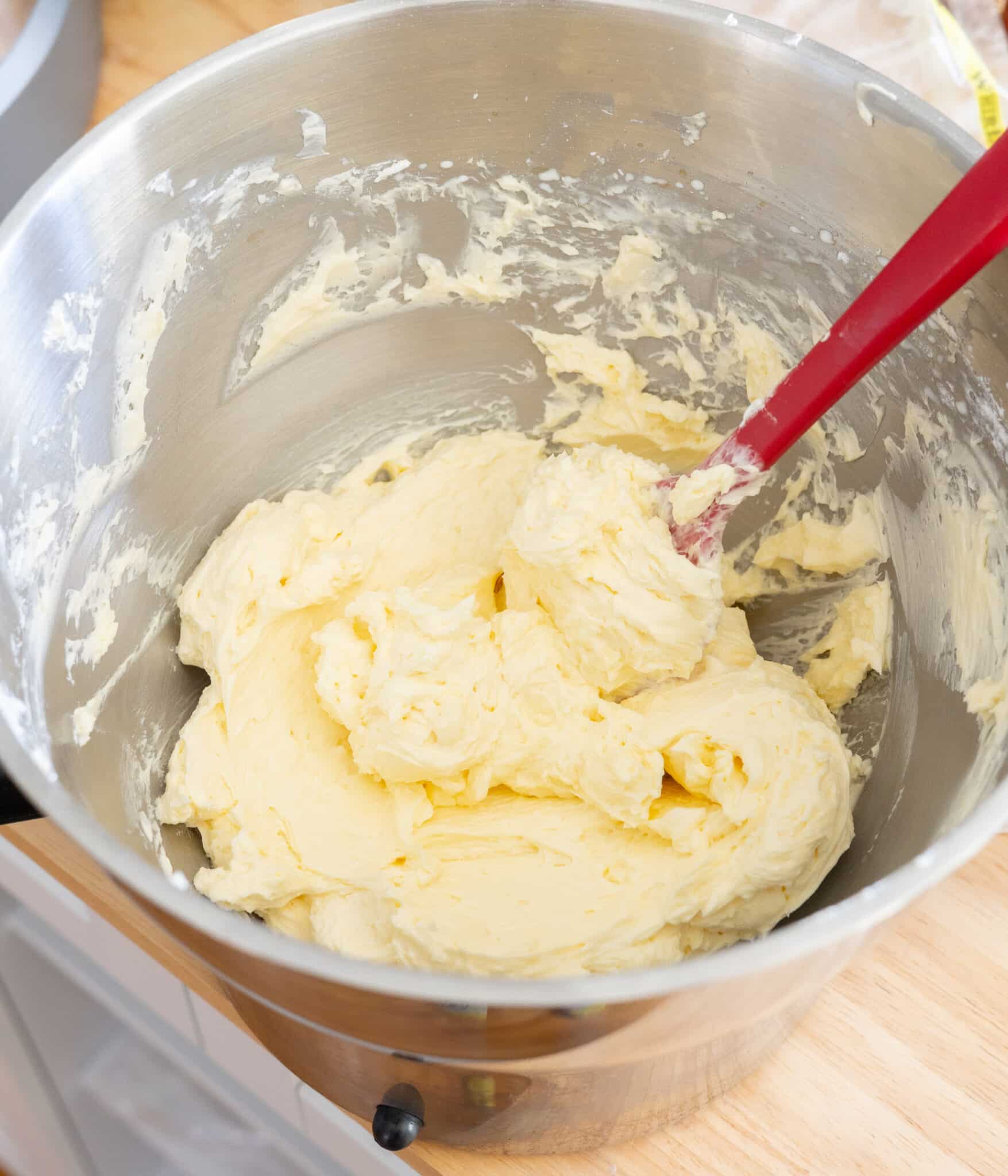 Silky smooth Swiss meringue buttercream in a metal bowl.
