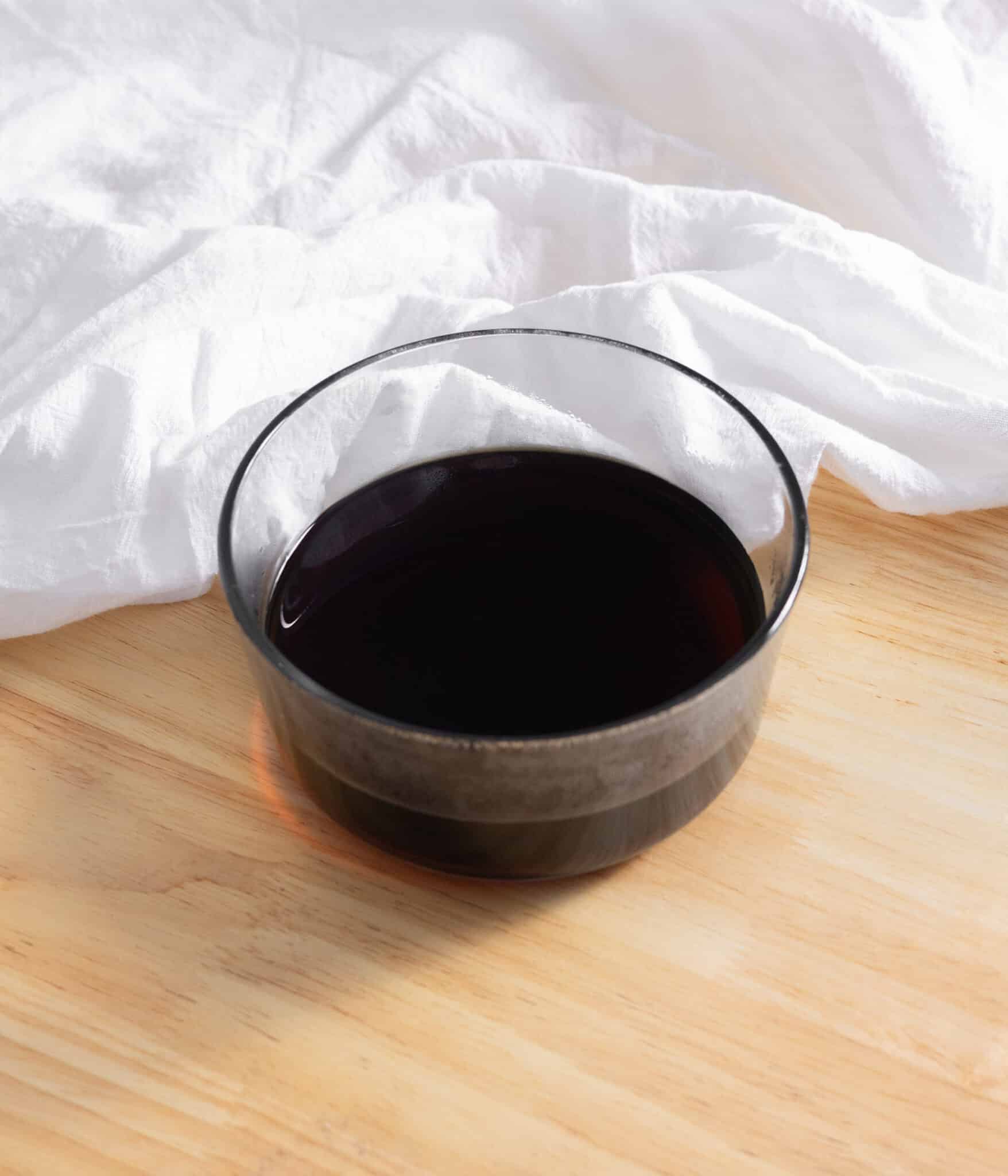 Brown sugar simple syrup in a glass container.