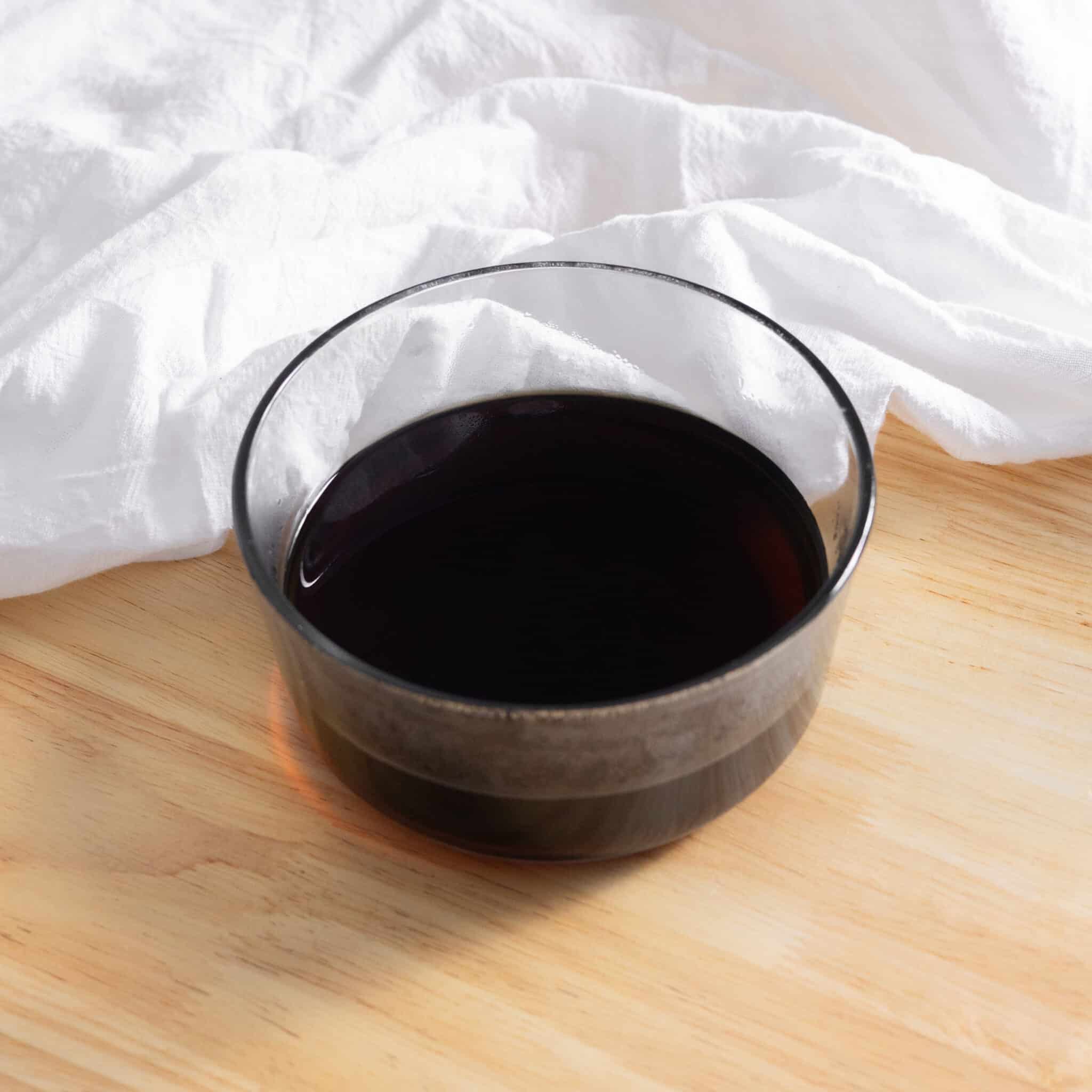 Brown sugar simple syrup in a glass container.