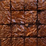 Crackle top brownies cut into 16 squares.