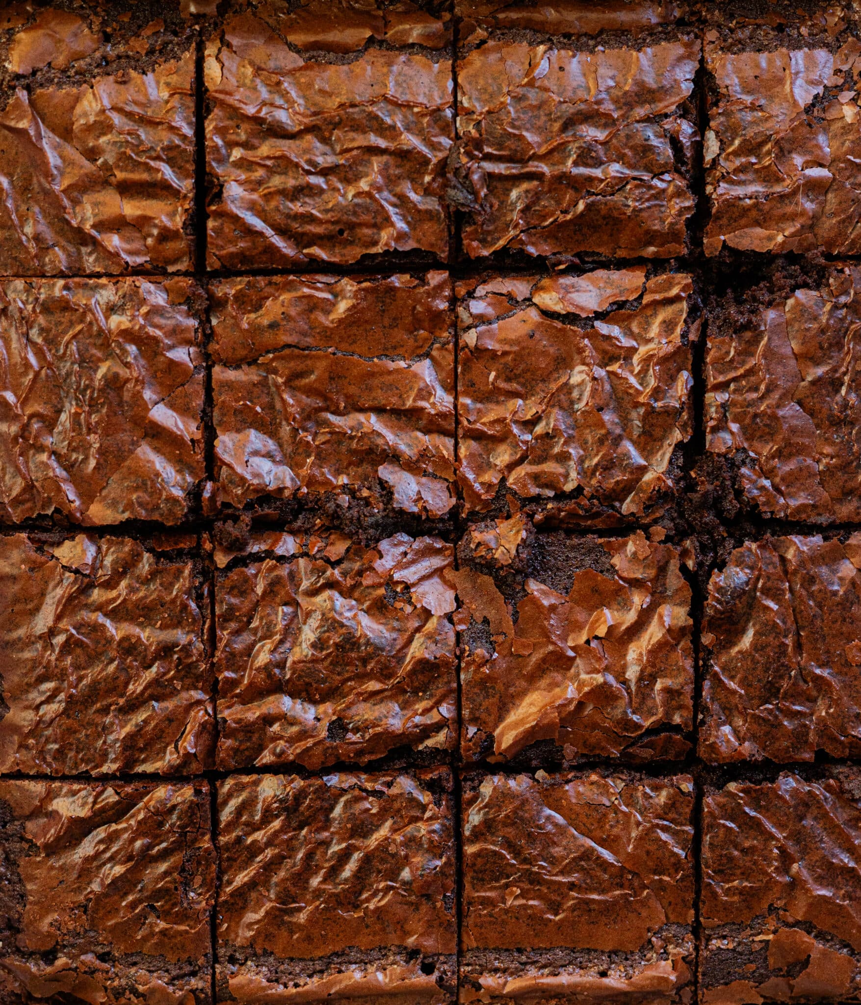 Crackle top brownies cut into 16 squares.